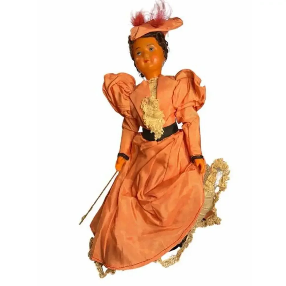 Doll The doll's attire, with its prominent 